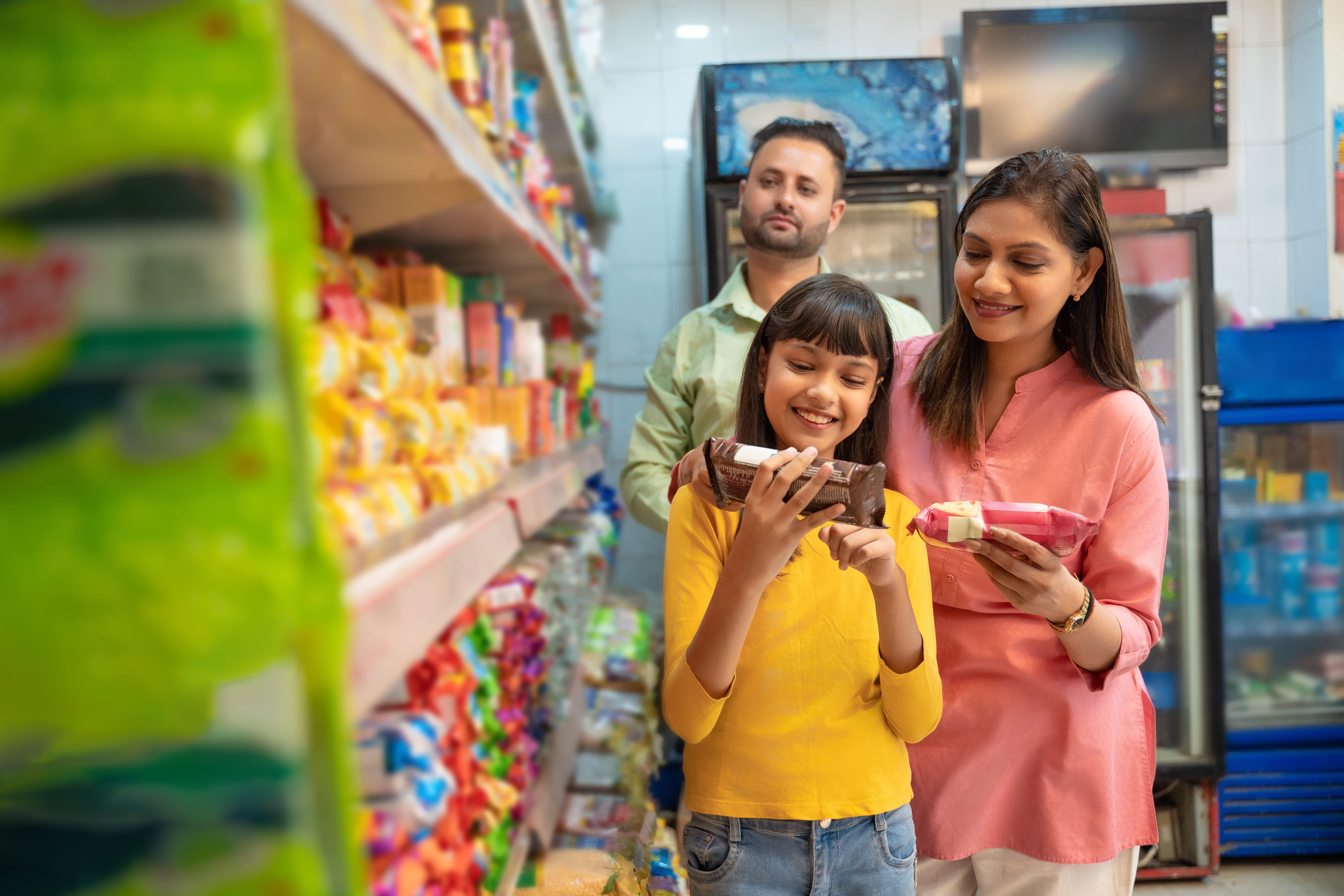 Image depicting and Indian family shopping at a supermarket